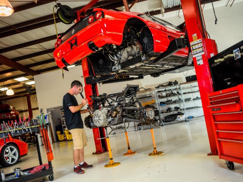Eric Krukow, owner and operator of F Imports & Exotics, preforming a Ferrari Repair | Luxury, Highline, Exotic car automotive service center and repairs Southwest Florida